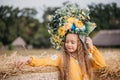 Girl carries fluttering blue and yellow flag of Ukraine in field Royalty Free Stock Photo