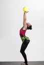 Girl train acrobatics with ball in sportswear. girl training with sport ball isolated on white.