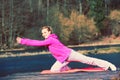 Girl train outside in park. Royalty Free Stock Photo