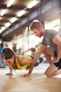 Girl train with trainer help Royalty Free Stock Photo