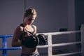 Girl with trainer pounching boxing gloves on the ring. Boxing female trainer Royalty Free Stock Photo