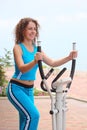 Girl on training apparatus outdoor Royalty Free Stock Photo