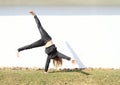 Girl training cartwheel Royalty Free Stock Photo