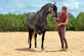 Girl training horse Royalty Free Stock Photo