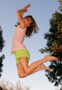 Girl on trampoline Royalty Free Stock Photo