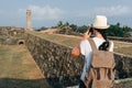 Girl traveler with a backpack and camera. Royalty Free Stock Photo