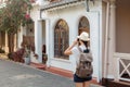 Girl traveler with a backpack and camera on the street Royalty Free Stock Photo