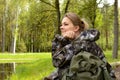Girl traveler in forest looks at forest. outdoor adventures outdoor. Forest holidays Royalty Free Stock Photo