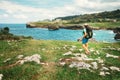 Girl traveler looks on beautiful sea landscape