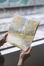 Girl with map in hand in train