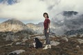 The girl travels in the mountains with her dog Royalty Free Stock Photo