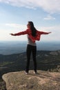 The girl travels through the mountains. Stylish hipster female traveler with a backpack. Royalty Free Stock Photo