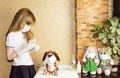 The girl treats her patients. Soft toys in masks