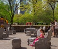 Girl tries out Furniture by Central Park Royalty Free Stock Photo