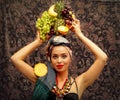 A girl with tropical fruit. Royalty Free Stock Photo