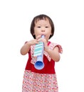 Girl with trumpet toy Royalty Free Stock Photo