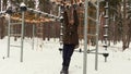 Girl try to hanging on monkey bars