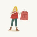 Girl trying clothes on. Hangers with clothing. Winter Christmas sweater. Hand drawn cartoon style flat concept