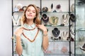 Girl trying on cornelian stone necklace Royalty Free Stock Photo