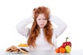 Girl trying to decide what to eat Royalty Free Stock Photo