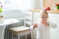 Girl trying to dry her freshly painted finger nails Royalty Free Stock Photo