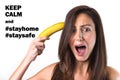 Girl trying to shoot herself with a banana gun Royalty Free Stock Photo