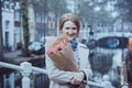 Girl with tulips on a street of Amsterdam Royalty Free Stock Photo