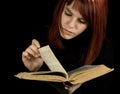 Girl turning book pages Royalty Free Stock Photo