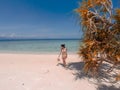 Girl on turquoise water and white beach in Camiaran island in Balabac in Philippines Royalty Free Stock Photo