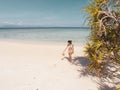 Girl on turquoise water and white beach in Camiaran island in Balabac in Philippines Royalty Free Stock Photo