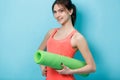Girl with twisted fitness mat