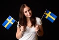 Girl with two Swedish flags