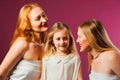 Girl with two women, all wearing white Royalty Free Stock Photo