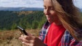 Girl typing message on mobile phone. Woman scrolling touchscreen on cellphone Royalty Free Stock Photo