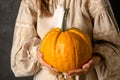 A girl in a Ukrainian dress holds a pumpkin, a symbol of rejection of a suitor Royalty Free Stock Photo