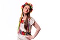 Girl in Ukrainian national traditional costume holding her flowe Royalty Free Stock Photo