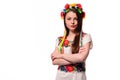 Girl in Ukrainian national traditional costume holding her flowe