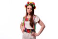 Girl in Ukrainian national traditional costume holding her flowe Royalty Free Stock Photo