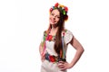 Girl in Ukrainian national traditional costume holding her flower chaplet - isolated on white Royalty Free Stock Photo