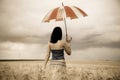 Girl with umbrella at field Royalty Free Stock Photo