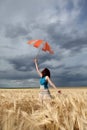 Girl with umbrella at field Royalty Free Stock Photo