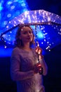 Girl with an umbrella in the night city with lights.Art photo Royalty Free Stock Photo