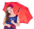 Girl with umbrella posing in studio. Royalty Free Stock Photo