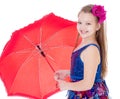 Girl with umbrella posing in studio. Royalty Free Stock Photo