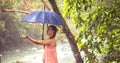 Girl with umbrella in a rain forest Royalty Free Stock Photo