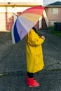 Girl under a multi-colored umbrella. bright picture Royalty Free Stock Photo