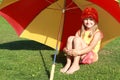 Girl under the red and yellow umbrella