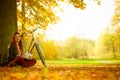 Girl under tree with bike. Royalty Free Stock Photo