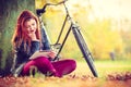 Girl under tree with bike. Royalty Free Stock Photo