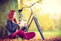 Girl under tree with bike. Royalty Free Stock Photo